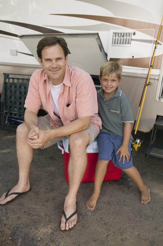 family in front of rv