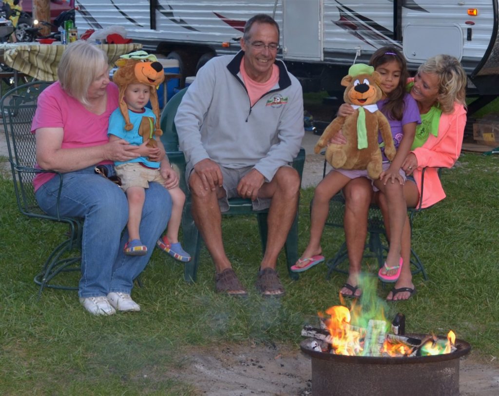 family in front of rv