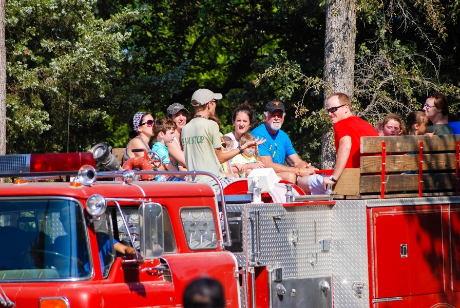 families riding a fire truck