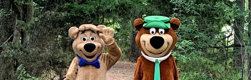 Yogi Bear & Boo Boo Bear Waving on the nature trail